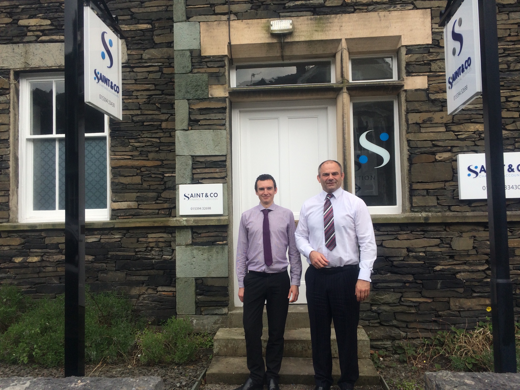 Darren Little is pictured above left with Ian Thompson outside our Ambleside Office
